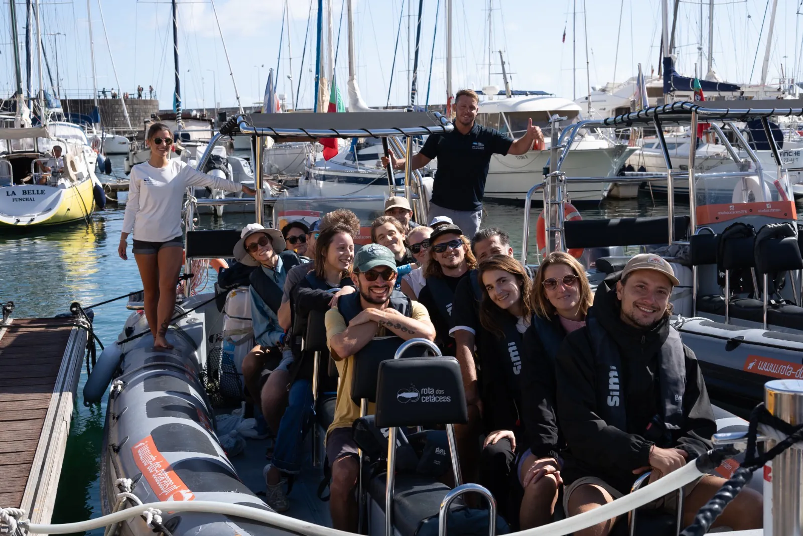 Volunteers on a boat for an ocean cleanup off Funchal
